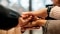 The picture shows hands of different skin colors.