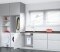 The picture shows Viessmann electric hot water systems under the kitchen sink. 