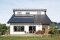 The image shows a house from outside with an electrical system.