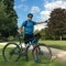 The picture shows a mountain biker in nature.