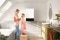 The image shows a mother and her daughter in a bathroom with Viessmann wall mounted appliance