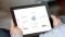 The image shows a tablet with the user interface of the Gridbox App.