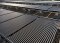 The image shows solar thermal collectors on a rooftop