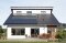 The image shows a house with photovoltaics.