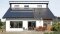 The image shows a house with photovoltaics.