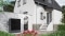 The image shows the Vitocal 250-A air-to-water heat pump in front of a house.