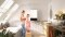 The image shows family in the bathroom with Vitodens.