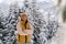The picture shows the former top biathlete Laura Dahlmeier in front of a wintry backdrop.