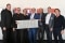 The image shows Dr. Frank Voßloh, Managing Director of Viessmann Deutschland GmbH (left), Prof. Dr. Klaus Wucherer, shareholder and Jan Bernd Faust, Managing Director of GeoCollect (4th and 5th from left) with the teams from Viessmann and GeoCollect