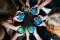 The image shows several children's hands with the earth made of plasticine.