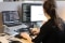 The image shows a WATTx employee at the computer. 